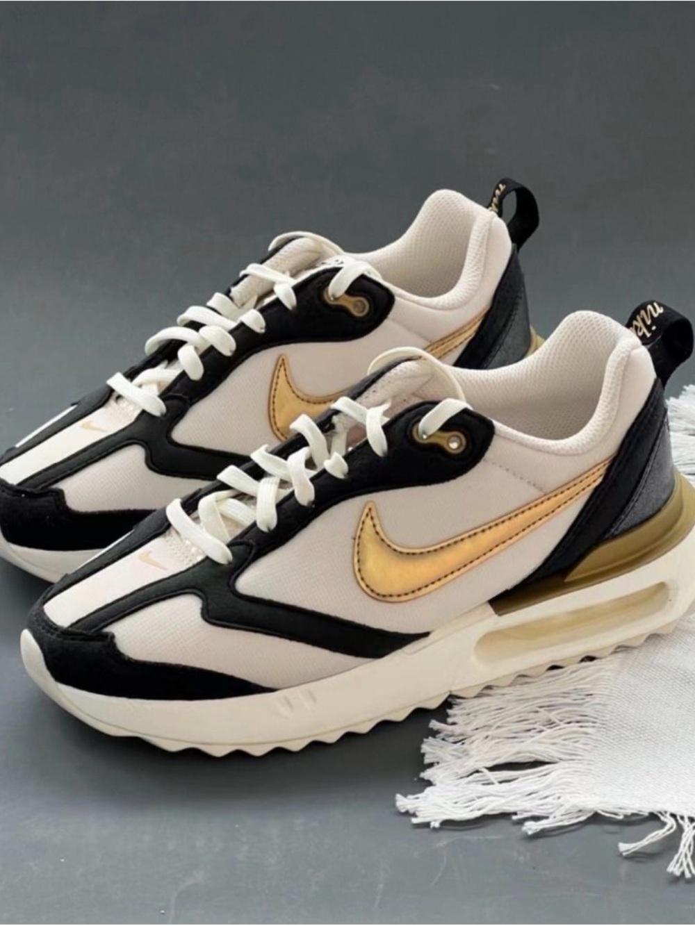 Nike Women's White Black Sneakers with Metallic Gold Swoosh
